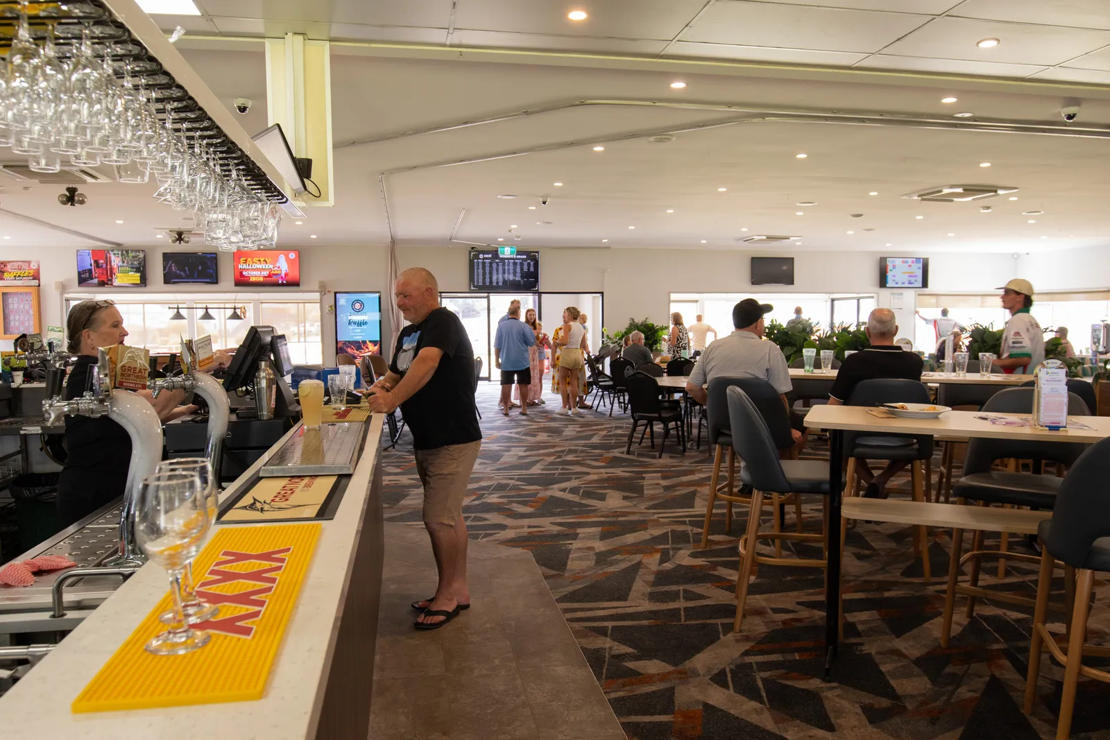 Members enjoying a drink in the club lounge and bar