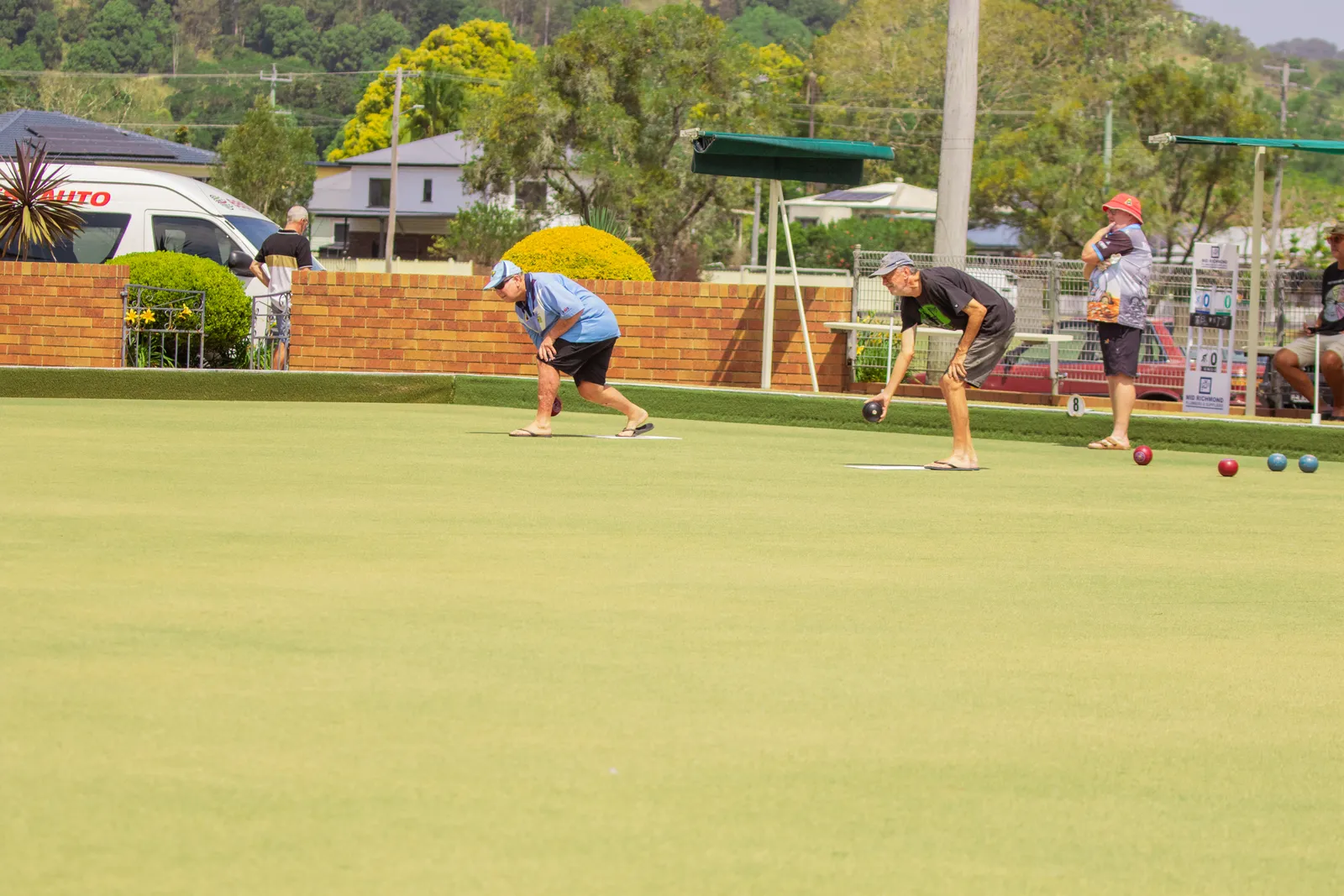 Members rolling up for a sunny game of social bowls